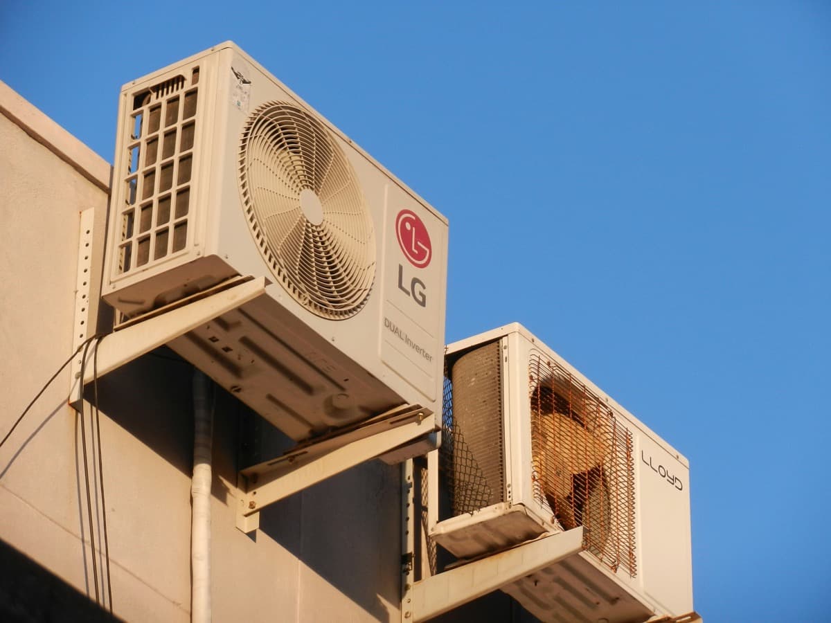 Commercial AC condenser units mounted on building exterior