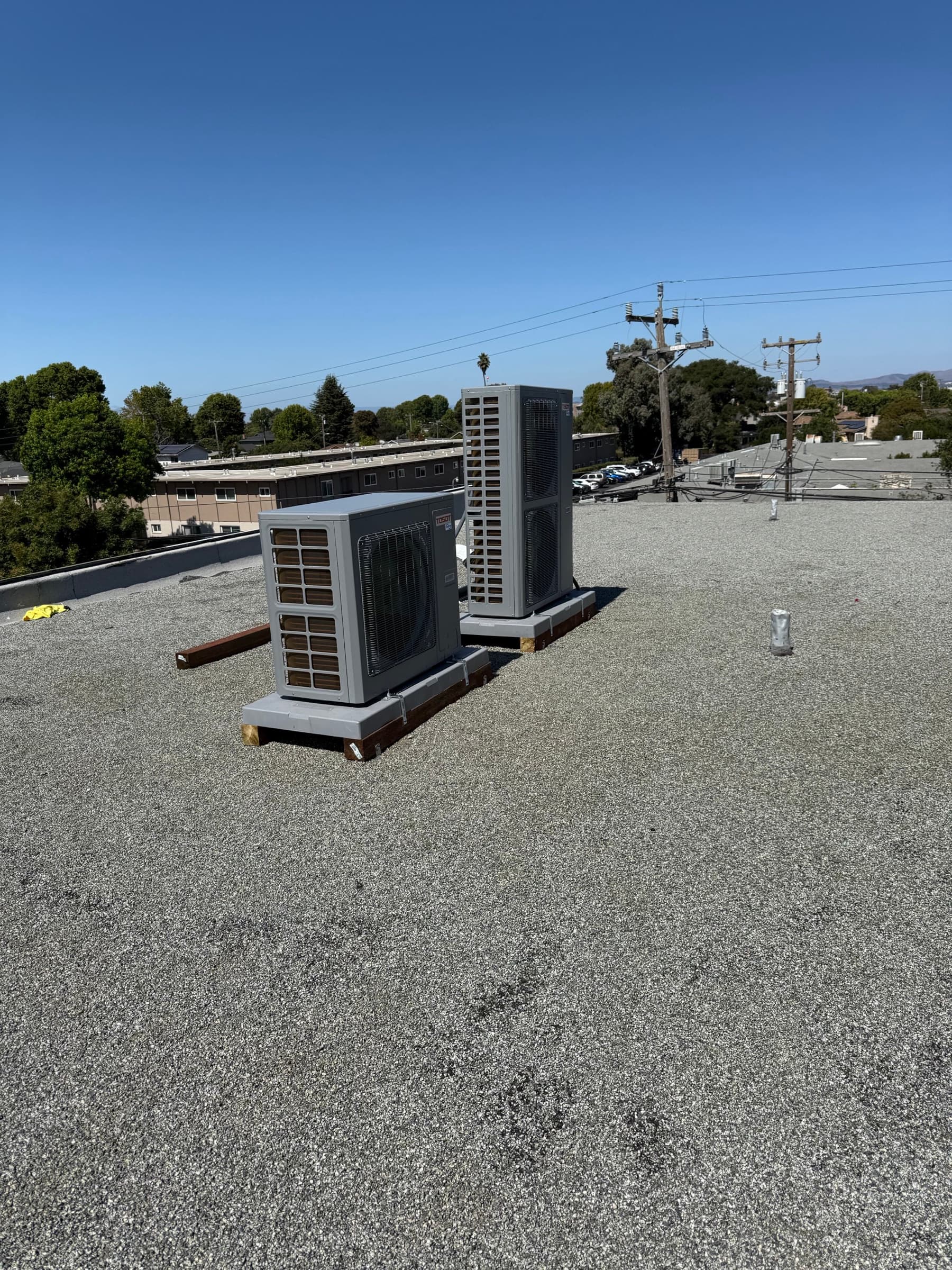 Completed rooftop heat pump installation, wide view